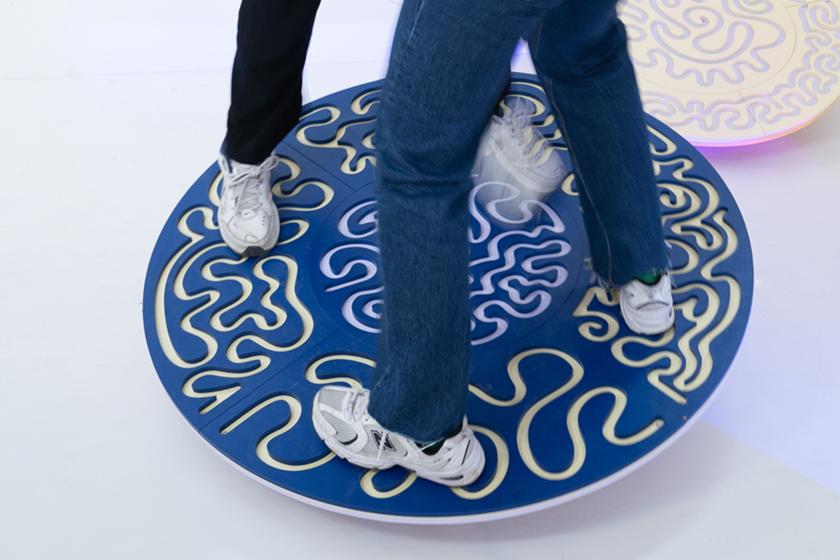 a balance board retrofitted with a maze